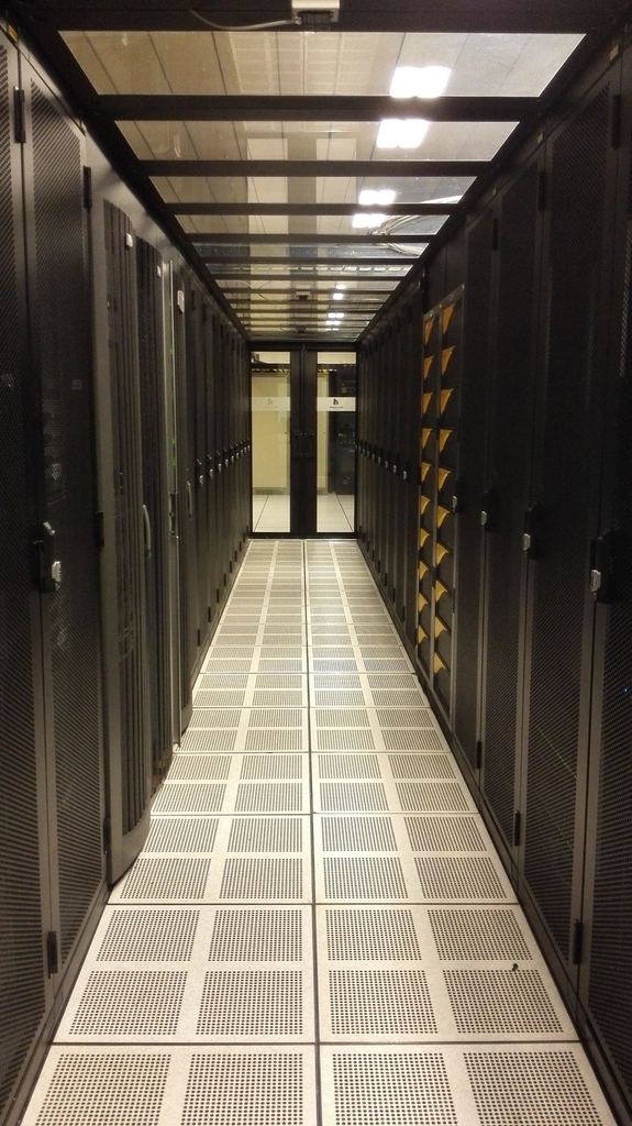 Data center corridor representing distributed model serving infrastructure